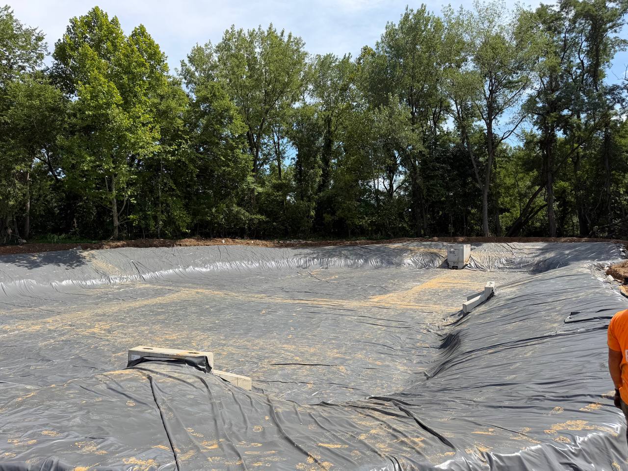 PVC liner installation in stormwater basin